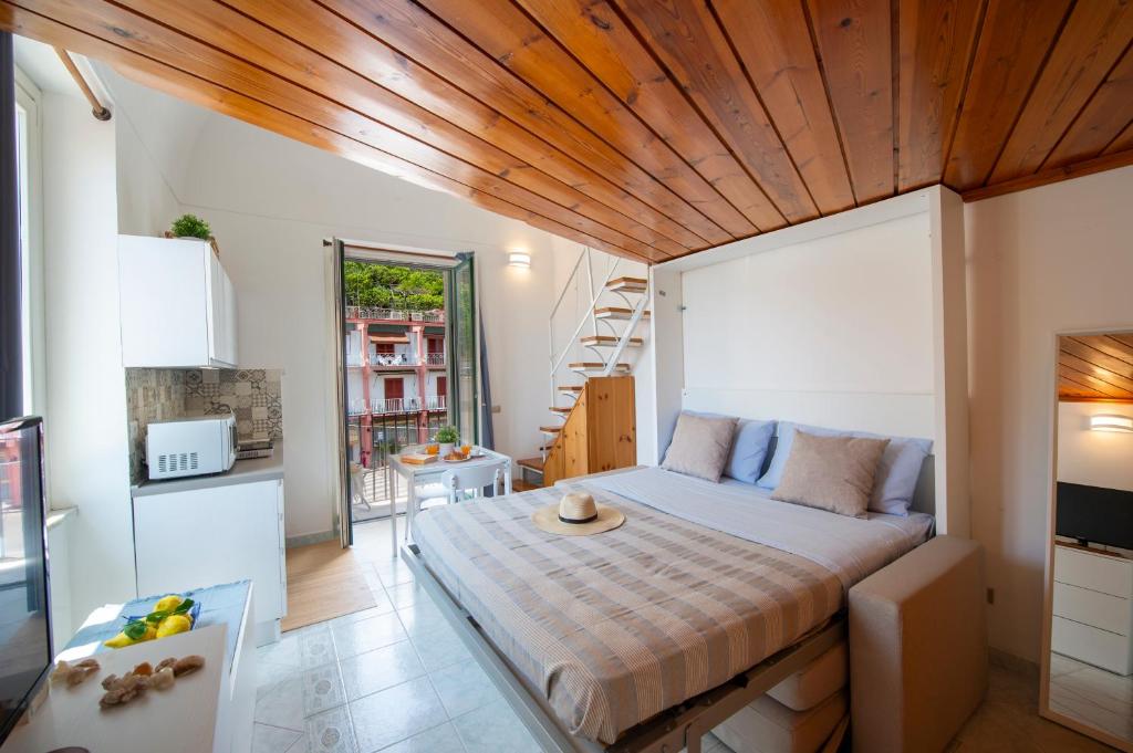 a bedroom with a large bed in a room at La Casetta di Camilla - Amalfi coast in Minori