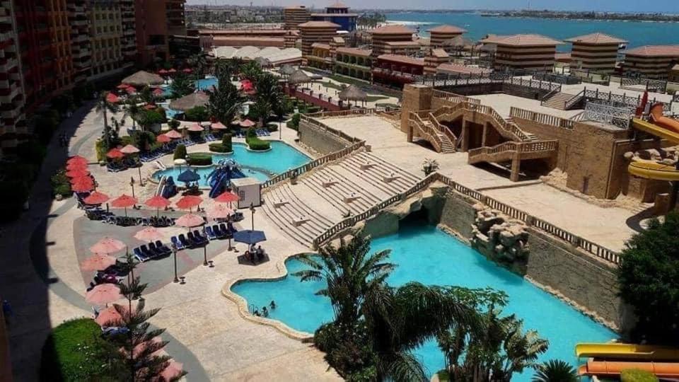 a view of the pool at a resort at شاليه بورتو مارينا على البحر in El Alamein