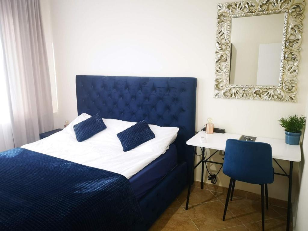 Voodi või voodid majutusasutuse Riviera Deluxe Apartments toas