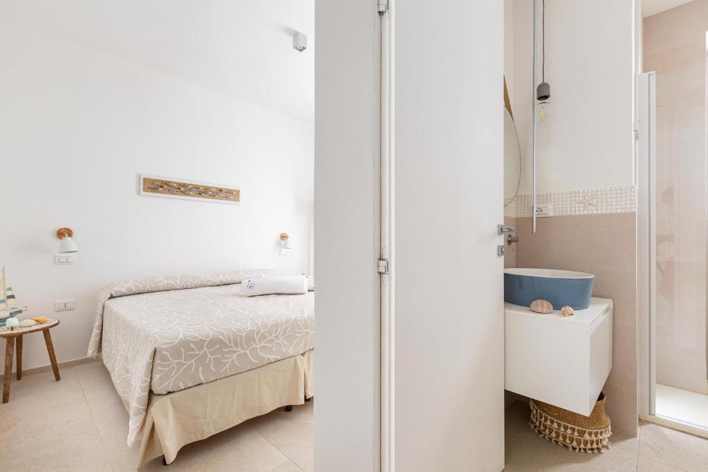 Postel nebo postele na pokoji v ubytování Villa Briosa Maldive del Salento Pescoluse