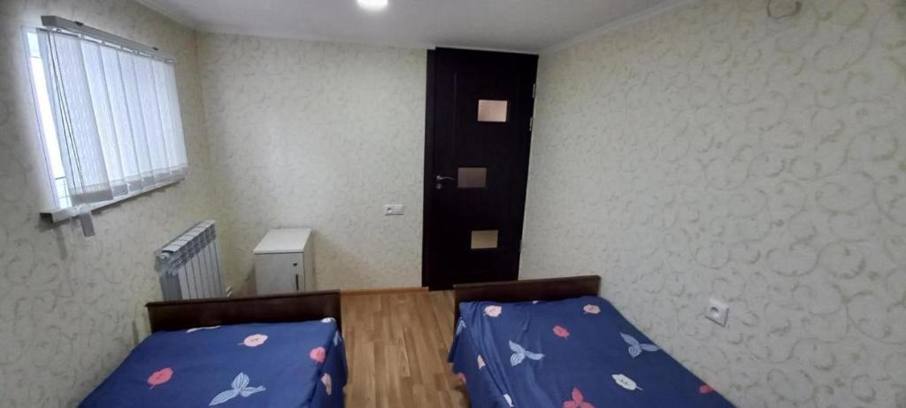 Postel nebo postele na pokoji v ubytování Dream House & Hostel