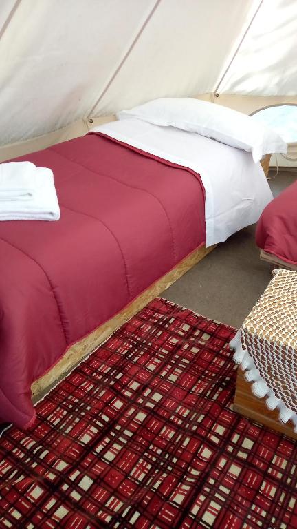 Voodi või voodid majutusasutuse Yurta con uso piscina e vista meravigliosa toas