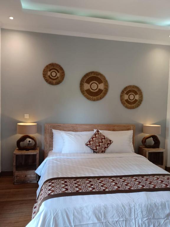 Postel nebo postele na pokoji v ubytování Karma House