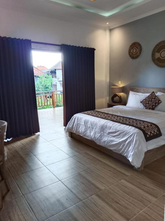 Postel nebo postele na pokoji v ubytování Karma House