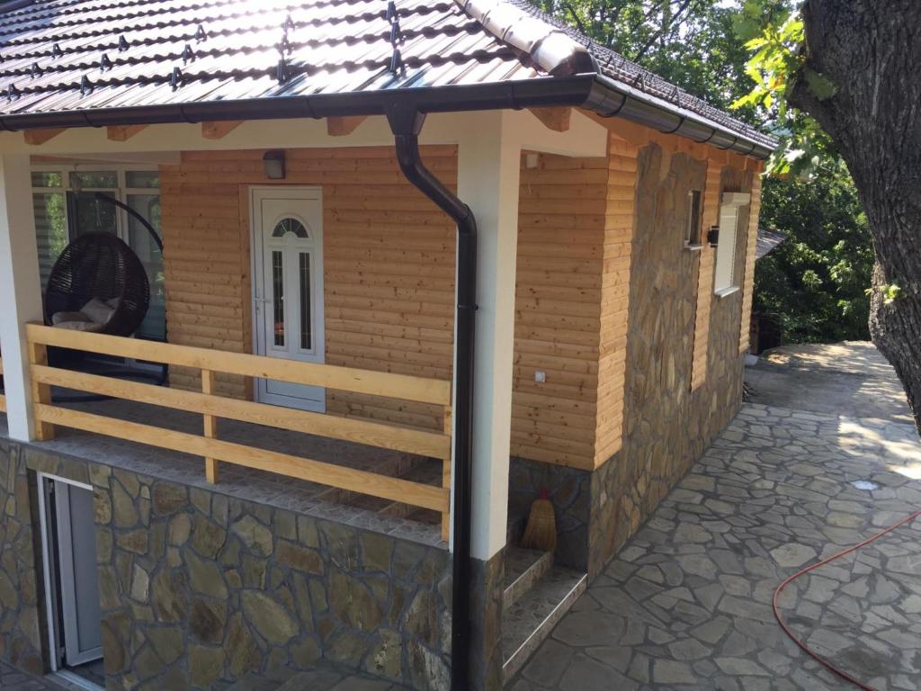 a dog house on a stone walkway at Stari Hrast 2 in Prolomska Banja