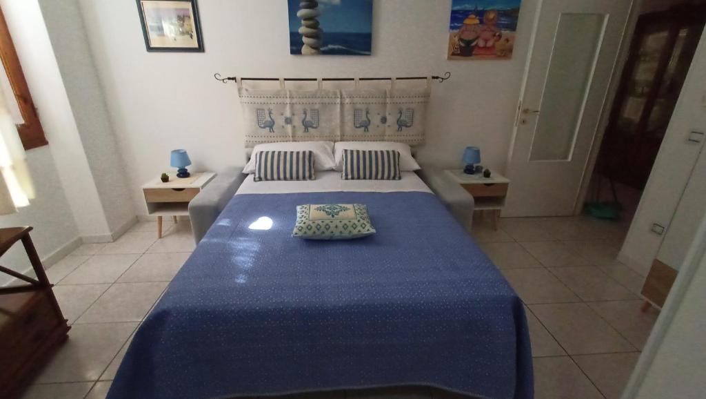 Postel nebo postele na pokoji v ubytování Le Peonie Guest House