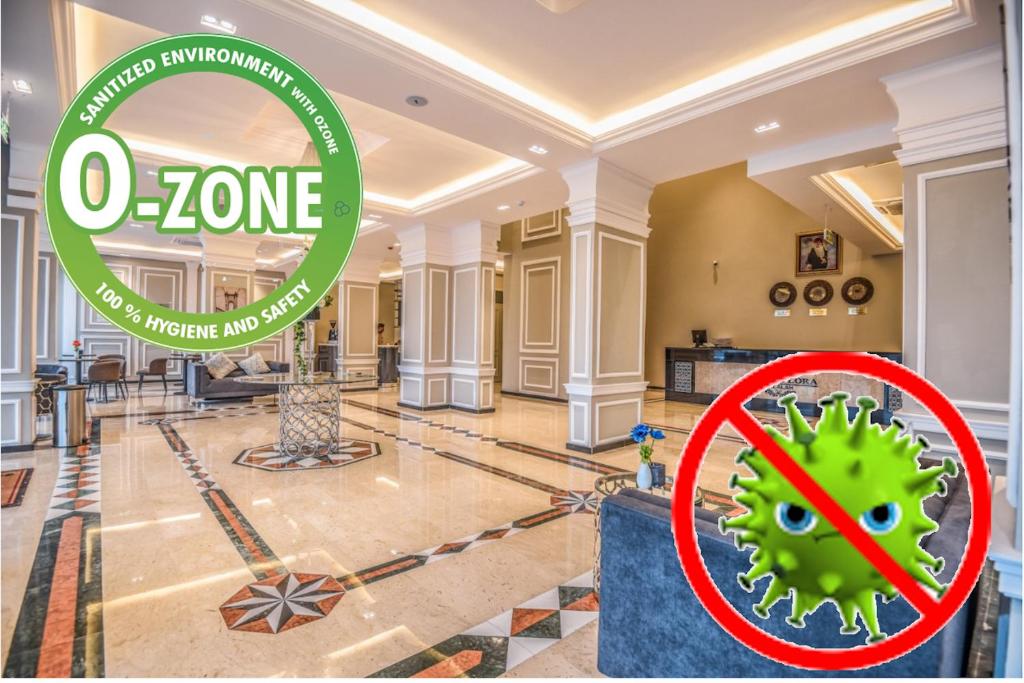 Ein Schild, auf dem steht, dass o Zone in einem Raum mit einem Virus in der Unterkunft Grand Flora Hotel in Salalah