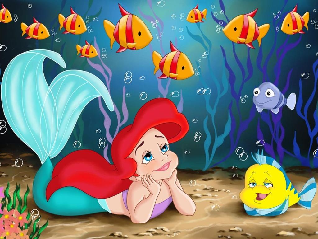 a little mermaid under the water with fish at Hostel Ariel Beach Pousada in Mongaguá