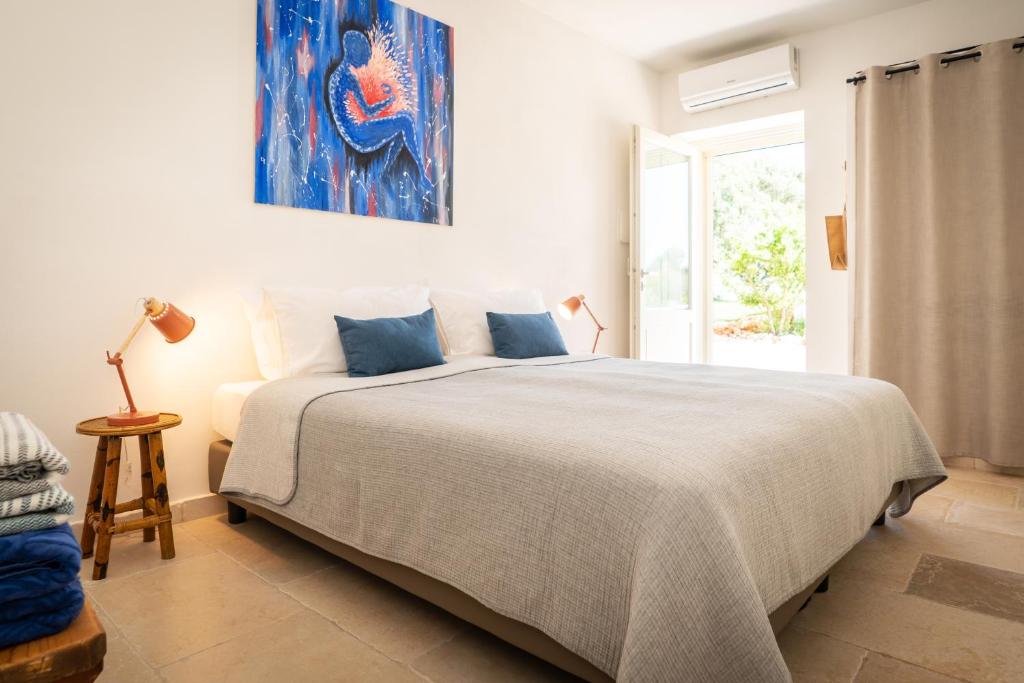Postel nebo postele na pokoji v ubytování Villa Gufo