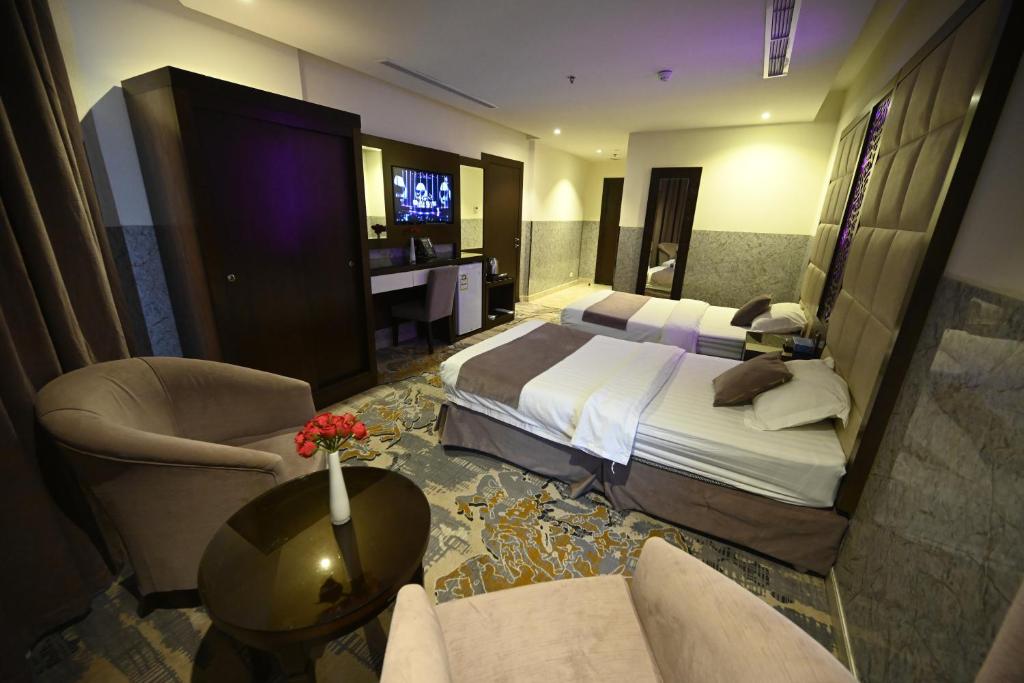 Postel nebo postele na pokoji v ubytování Aster Hotel