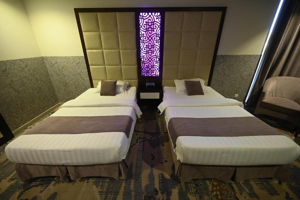 Postel nebo postele na pokoji v ubytování Aster Hotel