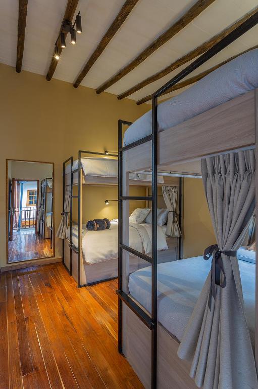 Postel nebo postele na pokoji v ubytování Casa Dreamer Bogotá
