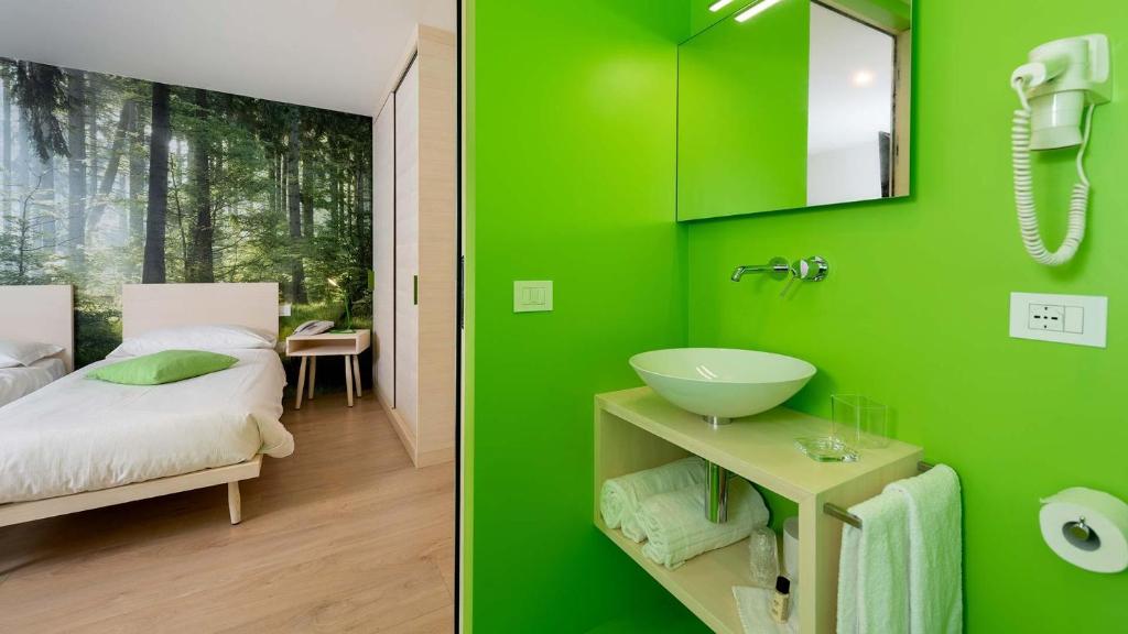 Postel nebo postele na pokoji v ubytování Hotel B&B Andreas