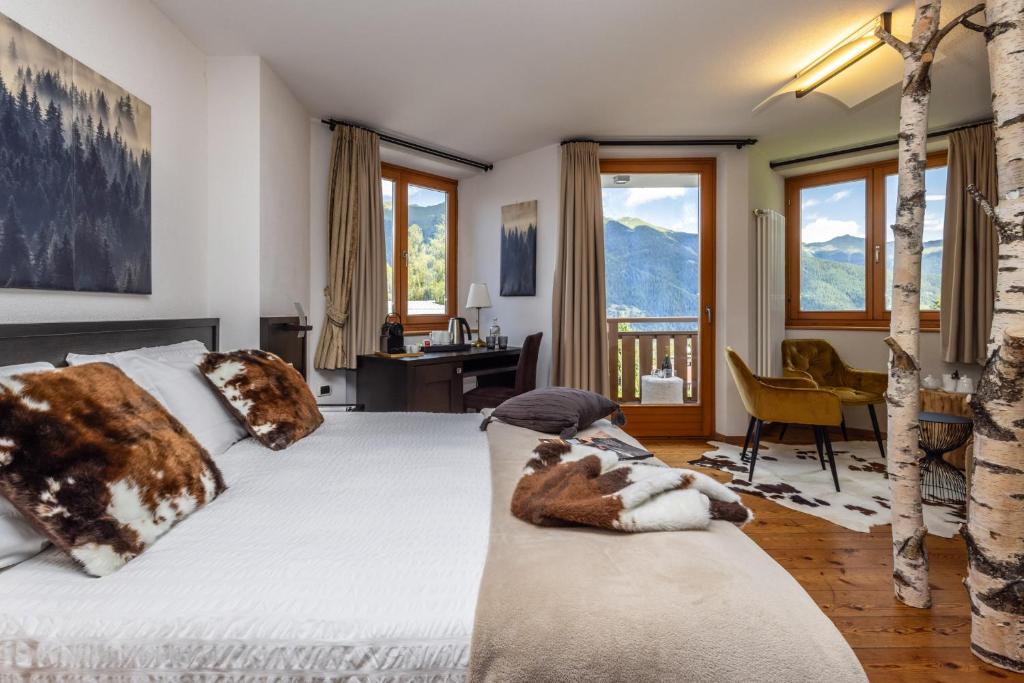 Postel nebo postele na pokoji v ubytování Hotel Folgarida