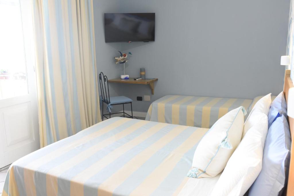 Postel nebo postele na pokoji v ubytování Villa Elicriso