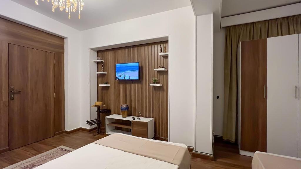 TV a/nebo společenská místnost v ubytování Osiris pyramids view inn