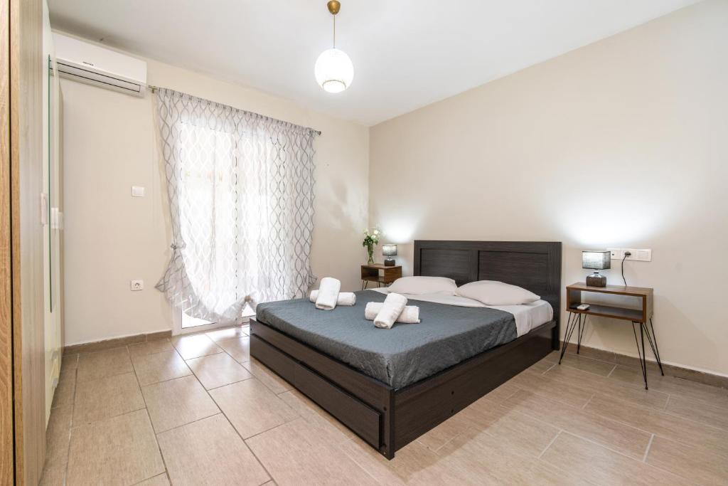 a bedroom with a bed with two pillows on it at Άνετο & ήσυχο διαμέρισμα για 4 in Athens
