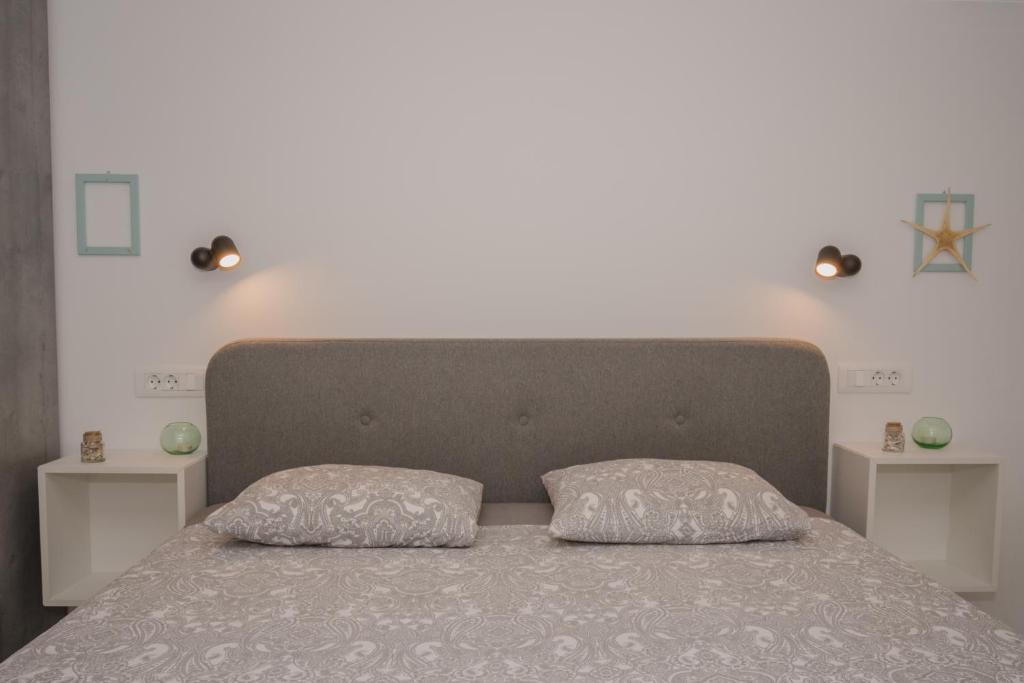 Postel nebo postele na pokoji v ubytování DeCoR Kut