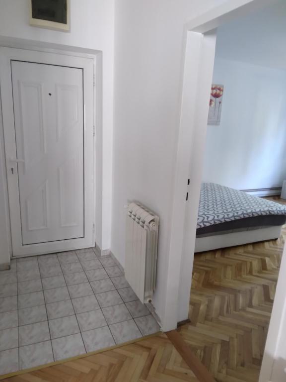 Postel nebo postele na pokoji v ubytování APARTMAN MARKOVIC
