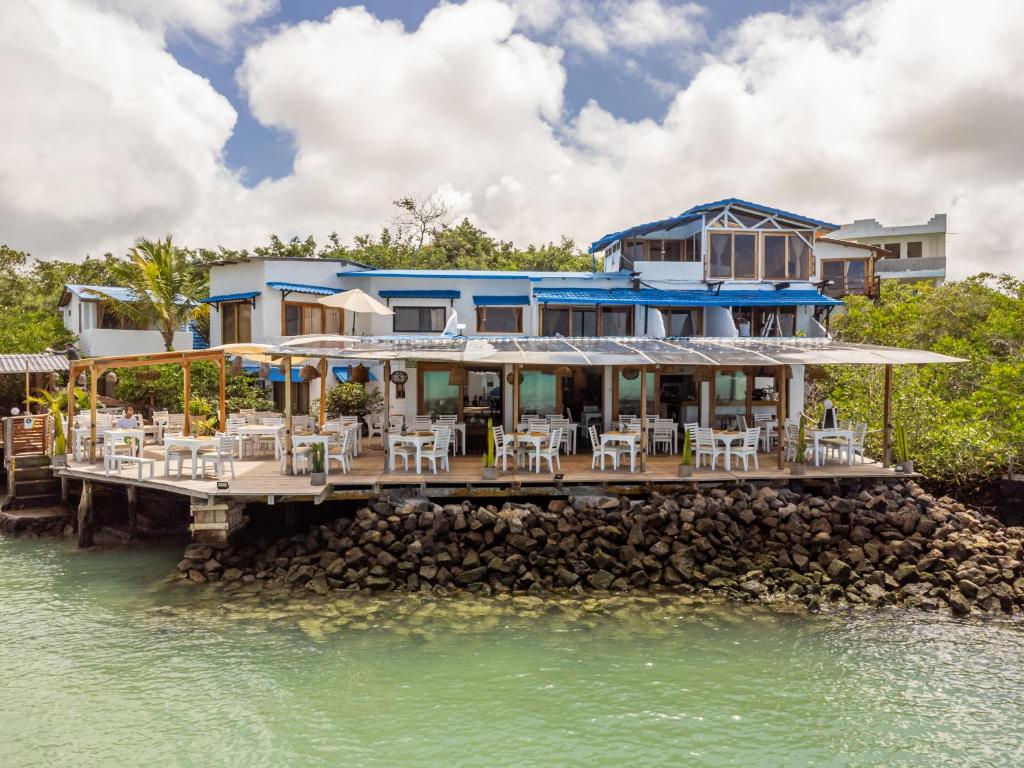 a house on a pier on the water at Blu Galapagos Sustainable Waterfront Lodge in Puerto Ayora