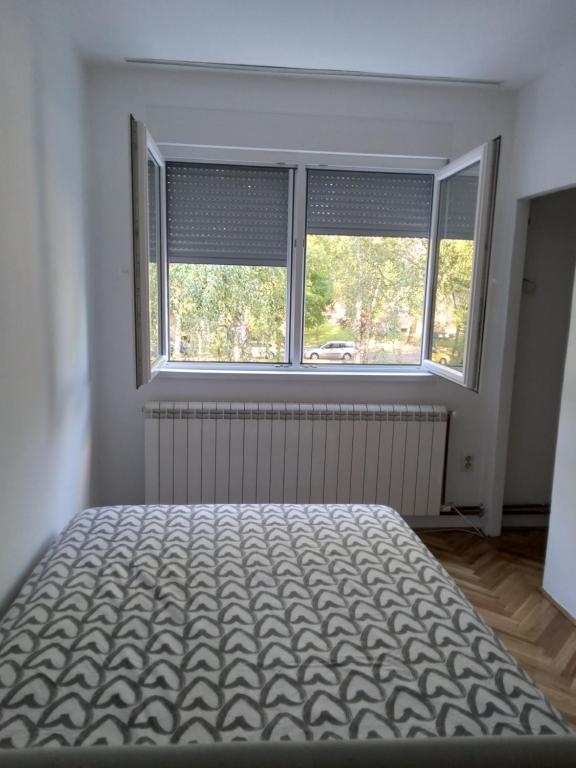 Postel nebo postele na pokoji v ubytování APARTMAN MARKOVIC