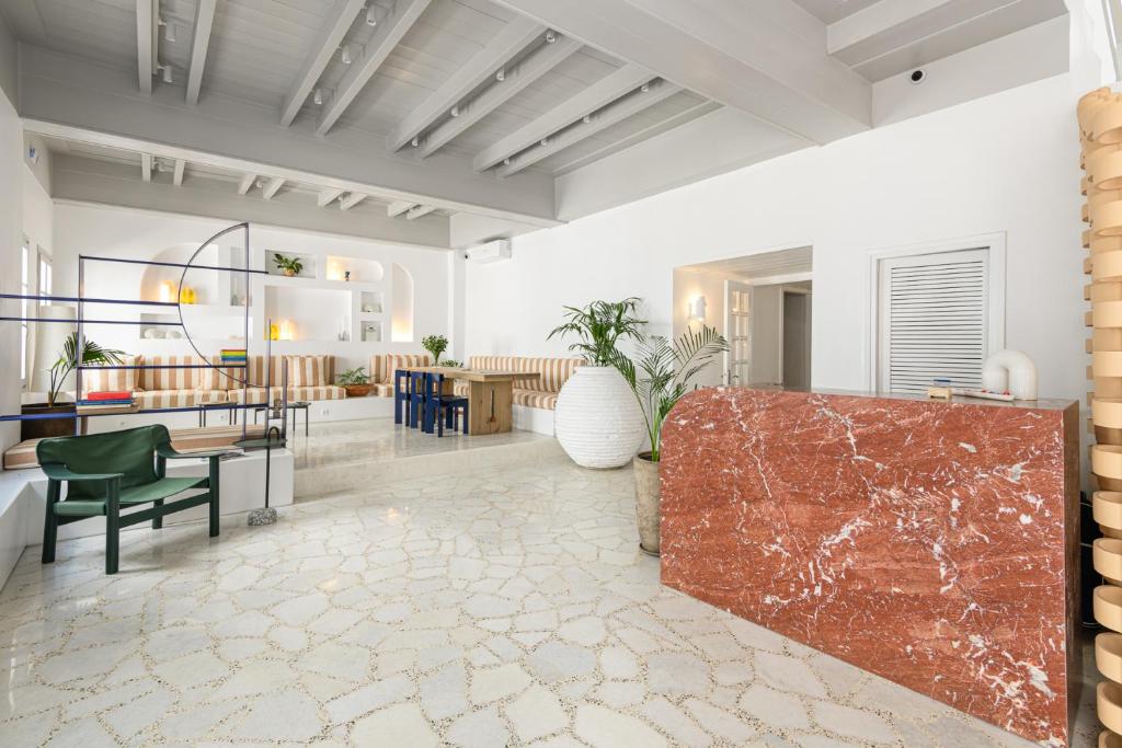 a living room with a couch and a table at Argonauta Hotel in Parikia