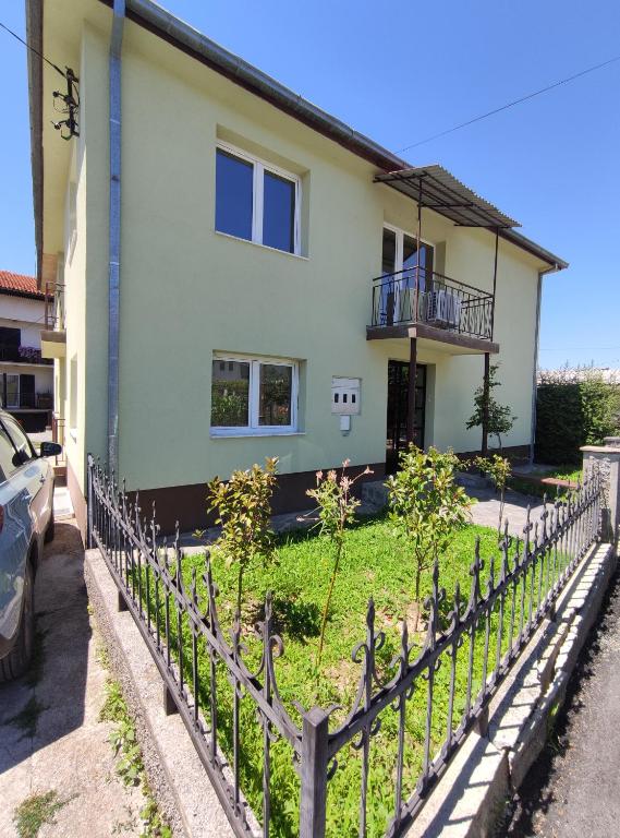 a fence in front of a house at Cozy Apartment Palazzo in Ohrid