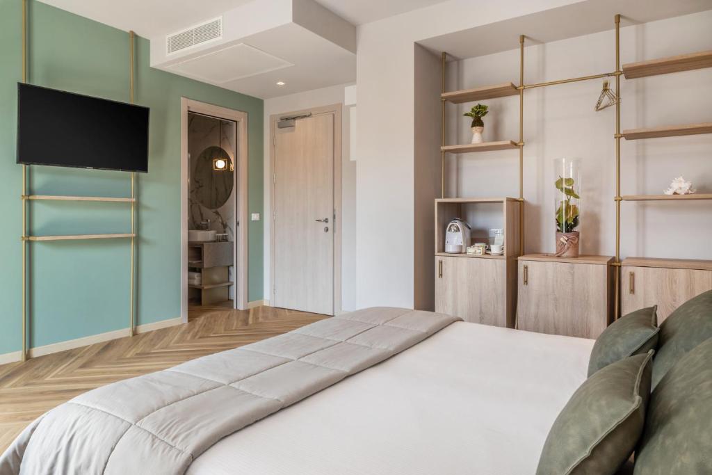 Postel nebo postele na pokoji v ubytování Salus Smart & Chic Hotel