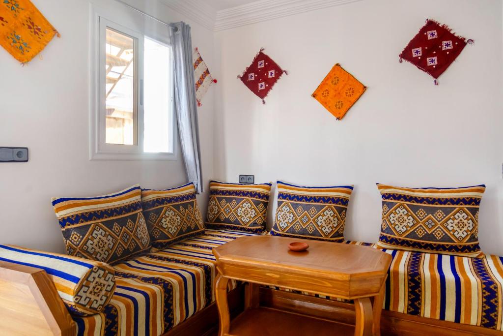 a living room with a couch and a table at The Rina Hostel in Agadir