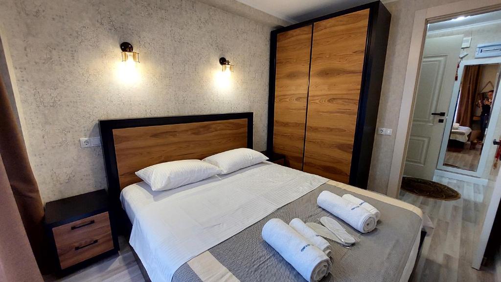 Säng eller sängar i ett rum på Apartment Rustaveli 118