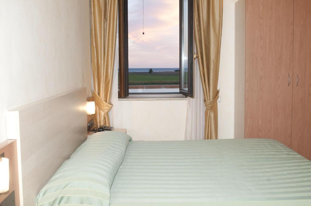Postel nebo postele na pokoji v ubytování Hotel Onda Bleu