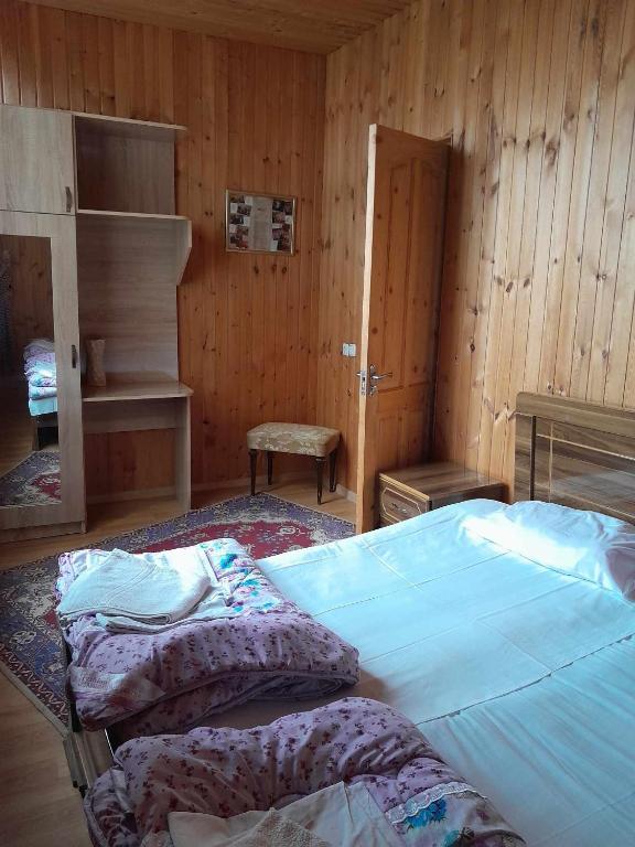 Postel nebo postele na pokoji v ubytování Guest House Guliada