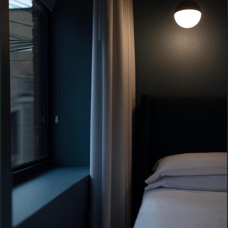 Postel nebo postele na pokoji v ubytování The Thomas Hotel - Premium Suite Main Level