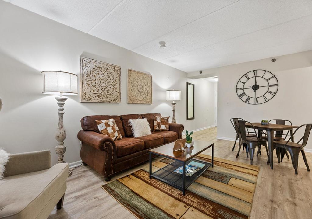 a living room with a couch and a table at Peaceful Gatlinburg Downtown Condo - 10 Mins Walk to Main Strip in Gatlinburg