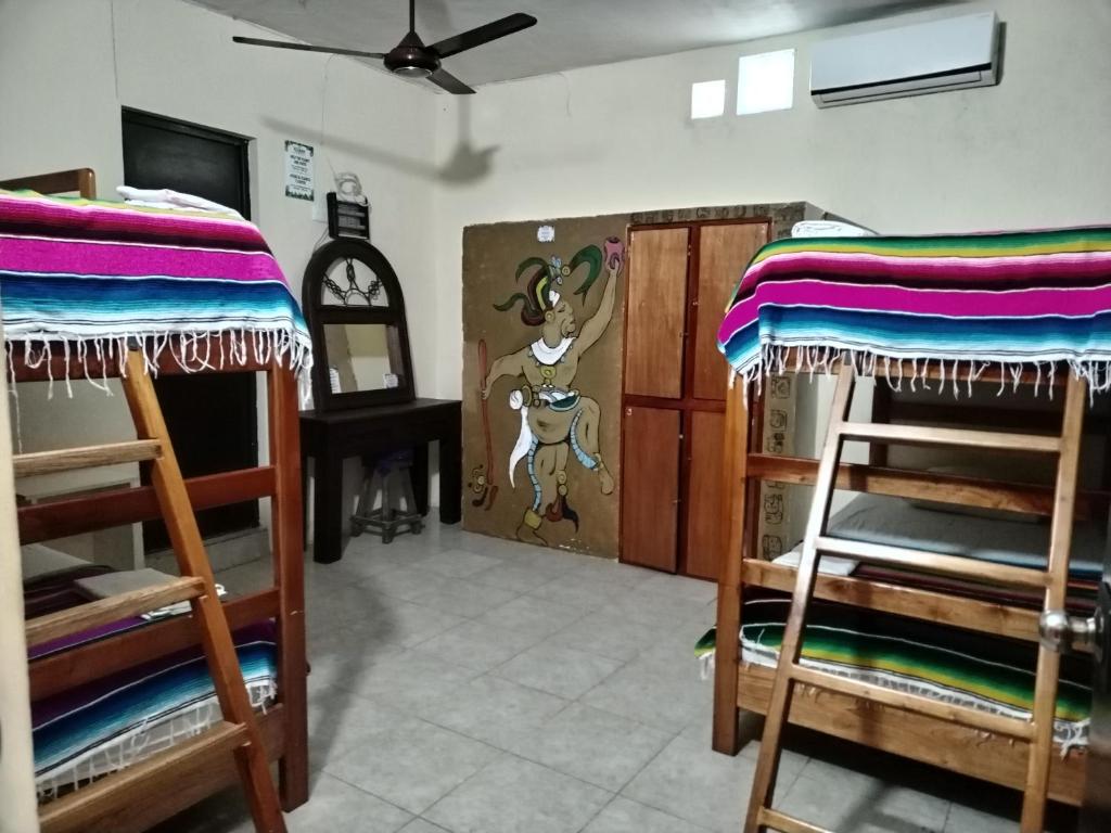 Una cama o camas en una habitación de Hostel Casa Xtakay