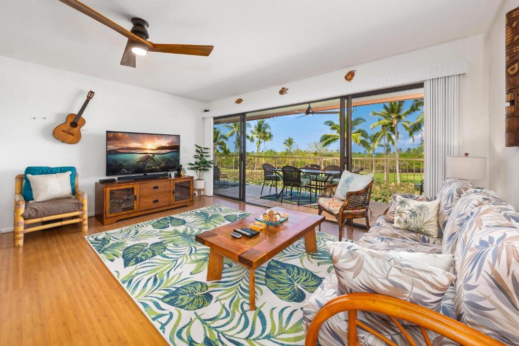 a living room with a couch and a table at Big Island Keauhou Punahele E202 condo in Kailua-Kona