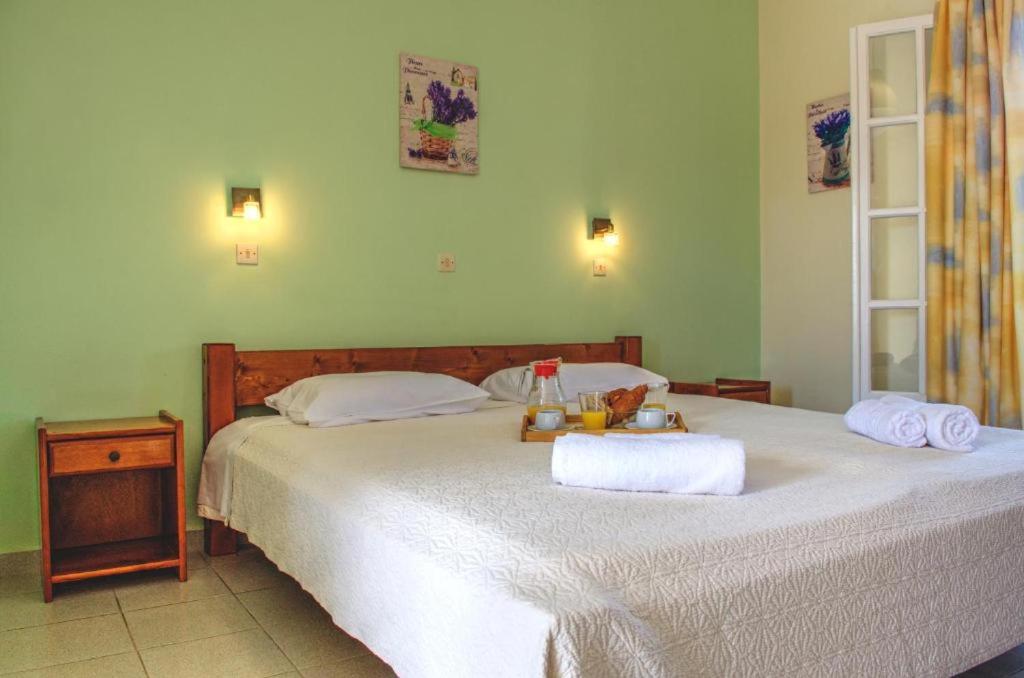 Postel nebo postele na pokoji v ubytování Jasmine Apartments