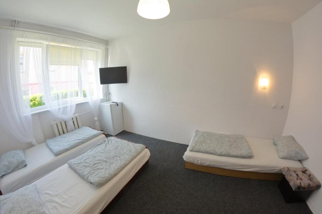Un pat sau paturi într-o cameră la Domek Krzyś