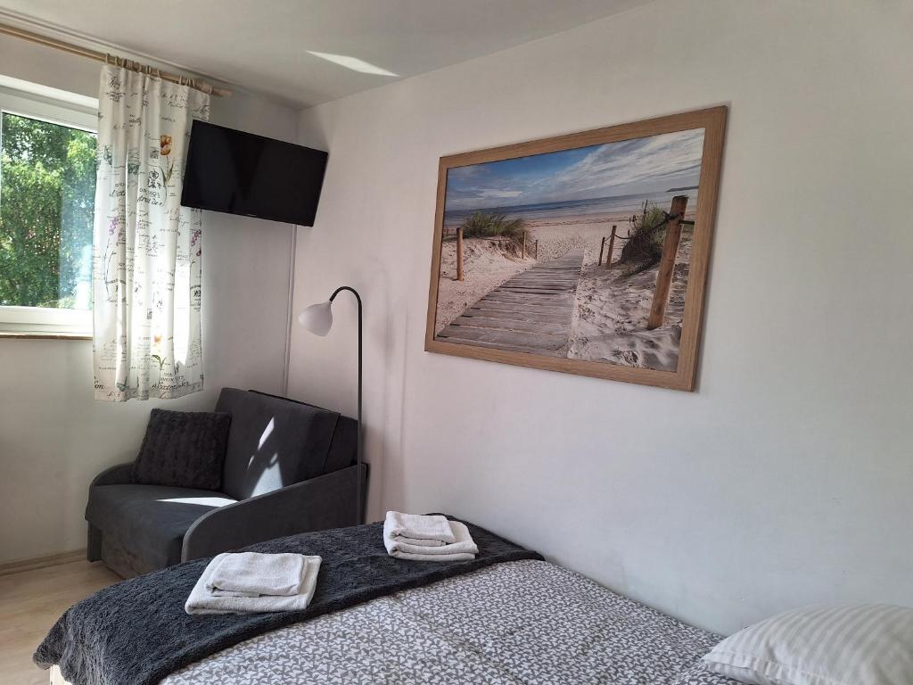 Postel nebo postele na pokoji v ubytování Nautilus Pearl