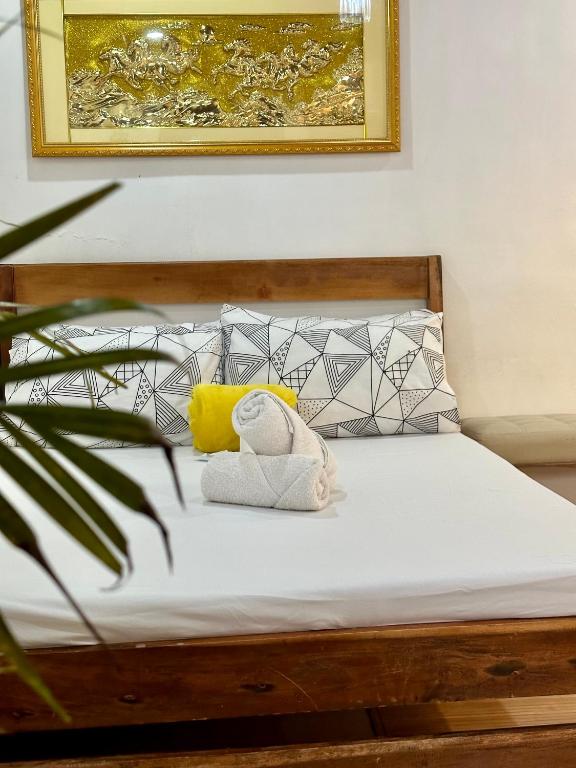 Postel nebo postele na pokoji v ubytování Tacloban EVMC Gdex Transient House