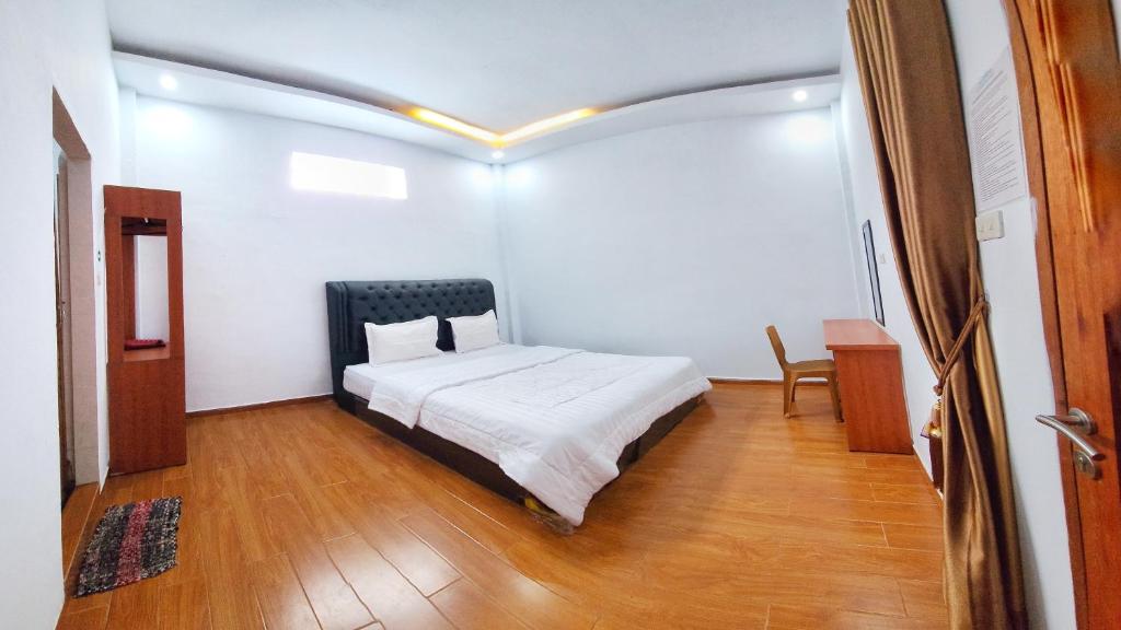 Postel nebo postele na pokoji v ubytování Depik Inn