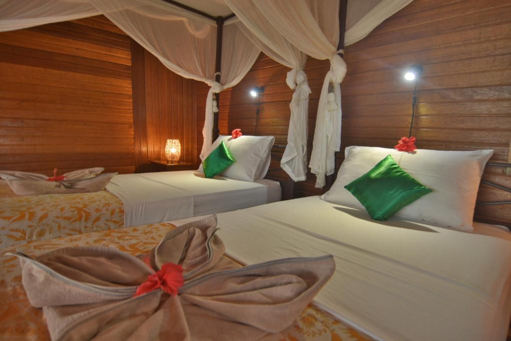 Postel nebo postele na pokoji v ubytování Nunukan Island Resort