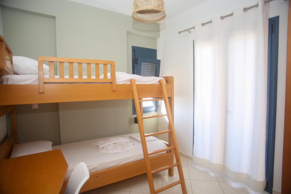 Postel nebo postele na pokoji v ubytování Frosini Seafront Loft