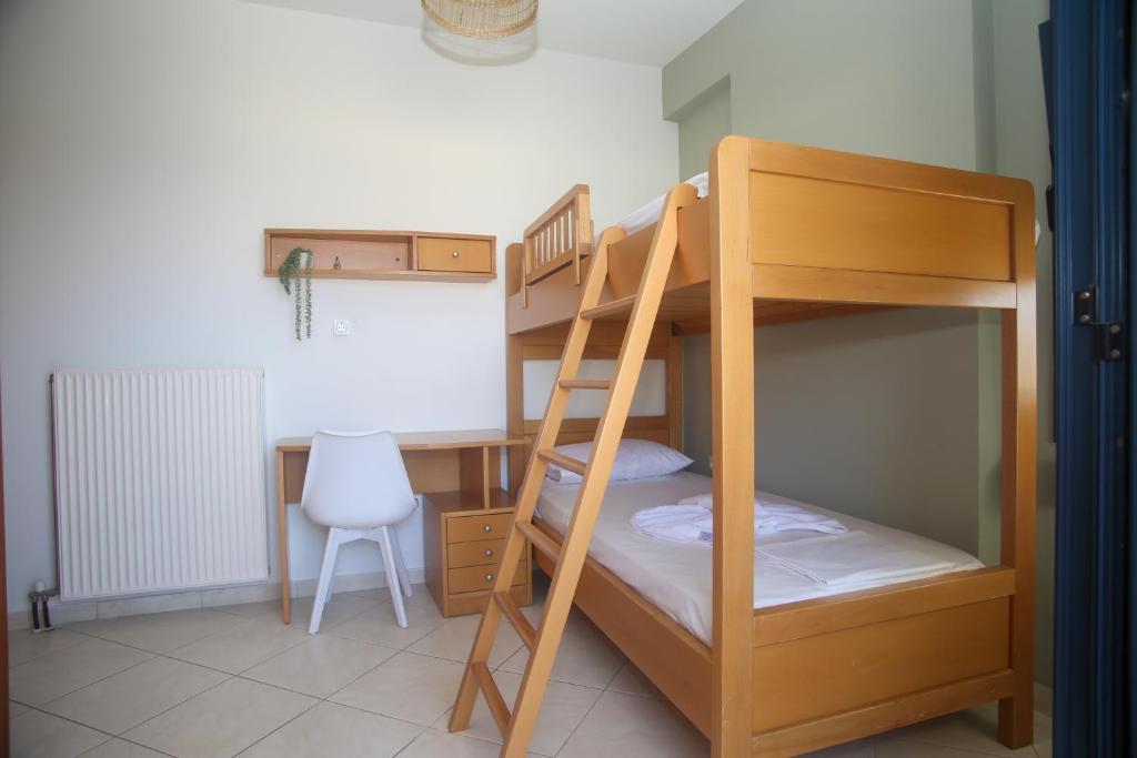 Postel nebo postele na pokoji v ubytování Frosini Seafront Loft