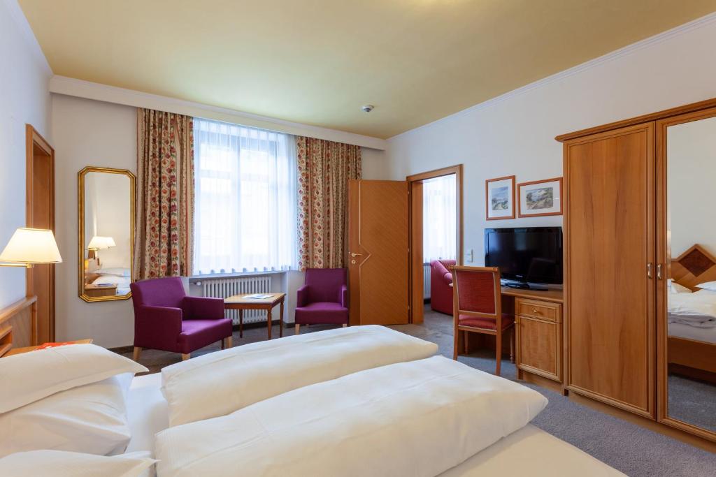 Postel nebo postele na pokoji v ubytování Hotel Post