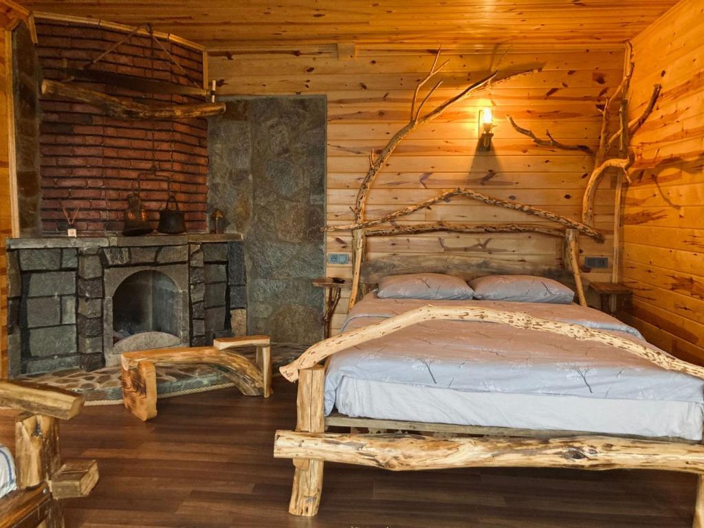 Postel nebo postele na pokoji v ubytování Şira Suit Bungalov