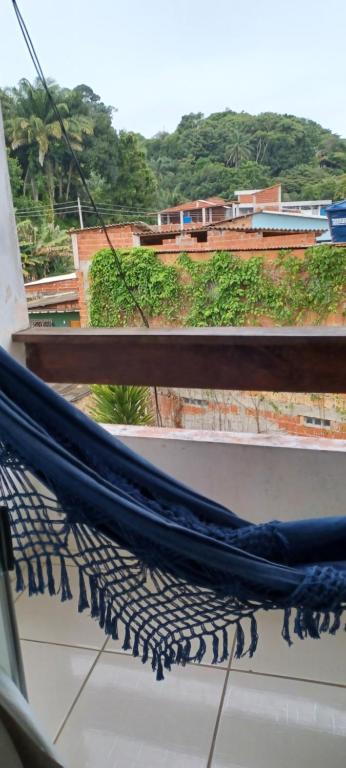 a hammock on top of a balcony with a view at adriana hostel in Itacaré