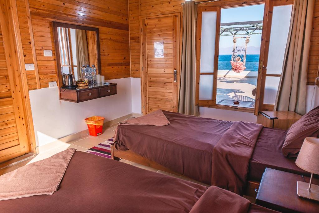 Postel nebo postele na pokoji v ubytování Club Red Dahab Motel