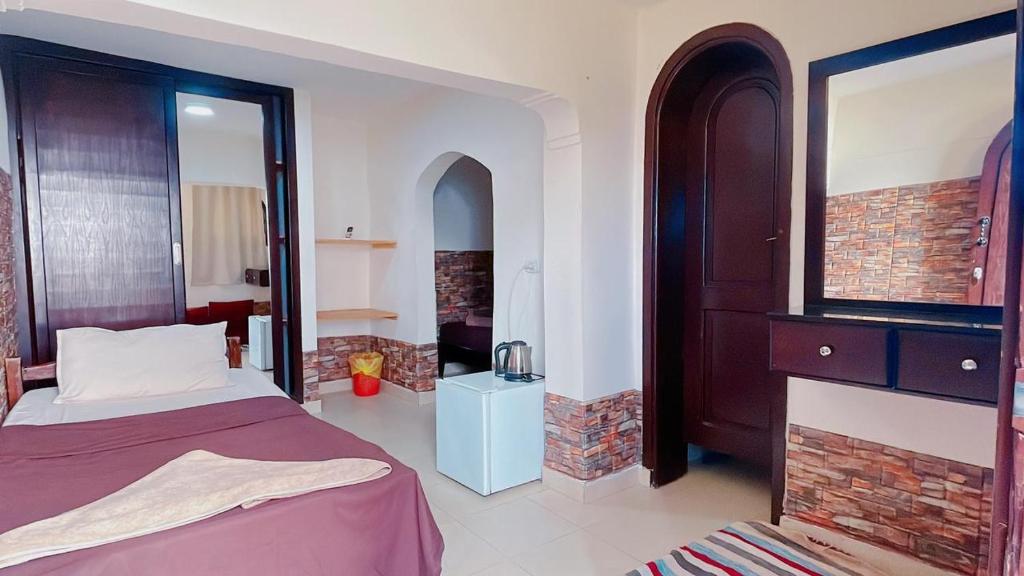 Postel nebo postele na pokoji v ubytování Club Red Dahab Motel