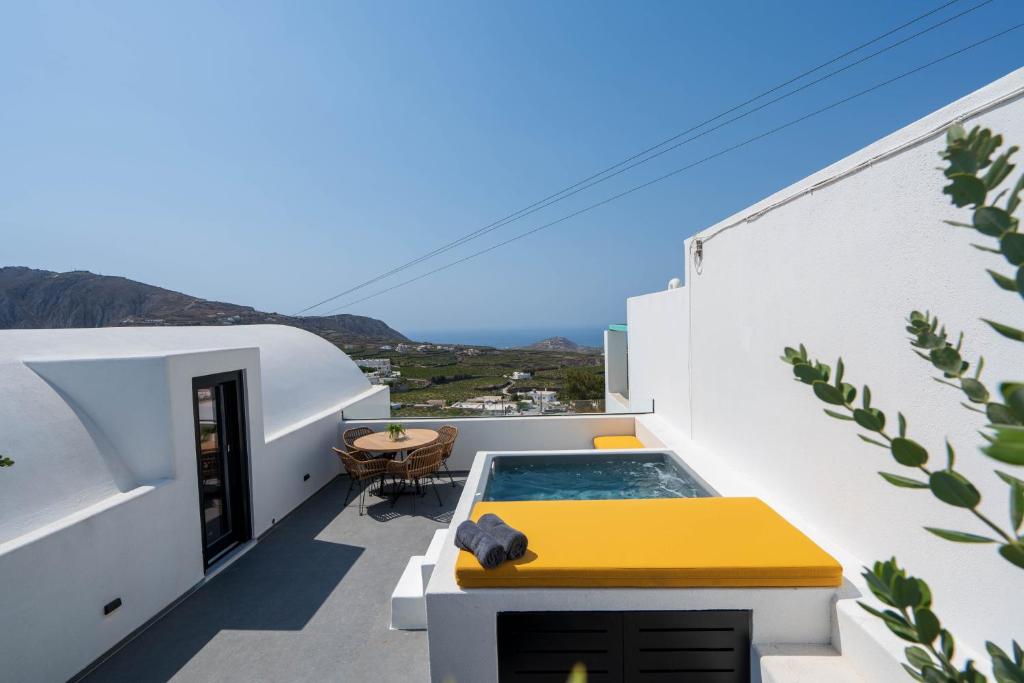 a balcony with a plunge pool on a white building at La Torretta in Pirgos